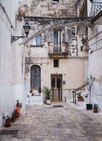 Grottaglie, italy. alley amidst buildings in city