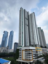 Low angle view of modern buildings against sky