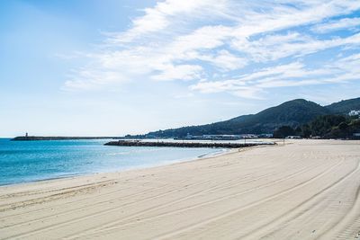 Scenic view of beach against sky