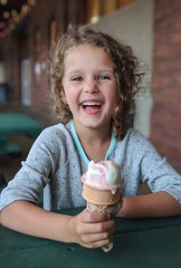 Portrait of smiling girl holding ice cream