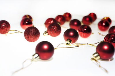 Close-up of cherries on white background