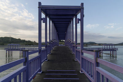 View of pier on bridge against sky