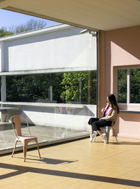 Young woman sitting on chair