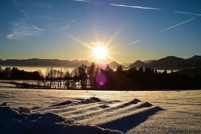 Scenic view of landscape against sky during sunset