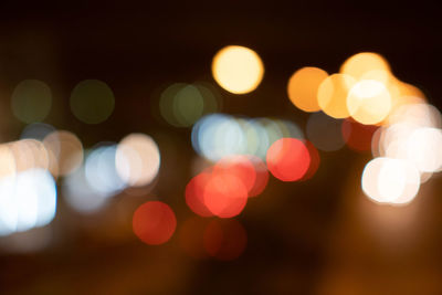 Defocused image of illuminated lights at night