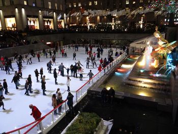 High angle view of crowd in illuminated city at night