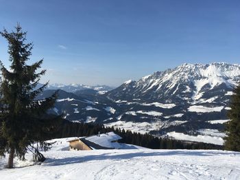 Scenic view of snow covered mountains against sky