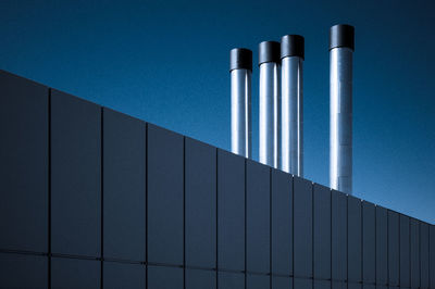 Low angle view of pipes of industry