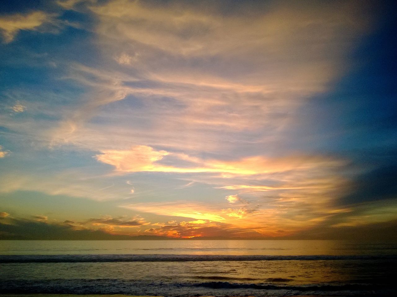 sea, water, horizon over water, scenics, sunset, tranquil scene, sky, tranquility, beauty in nature, beach, idyllic, cloud - sky, nature, shore, orange color, cloud, cloudy, waterfront, outdoors, remote