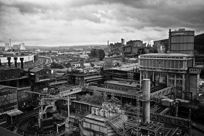 High angle view of buildings in city against sky