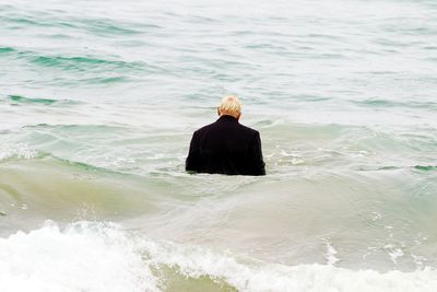 Rear view of woman on beach