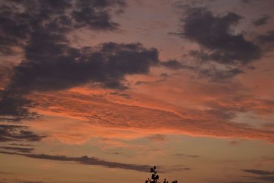 Low angle view of cloudy sky during sunset