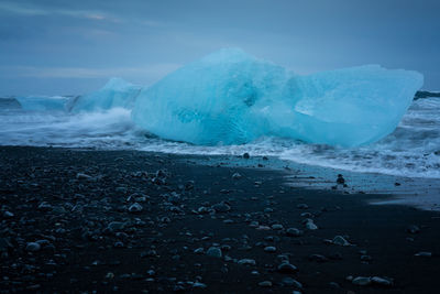 Scenic view of sea against sky during winter