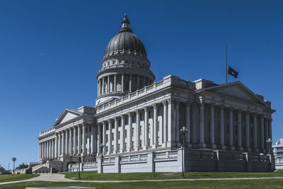 Low angle view of building against clear blue sky