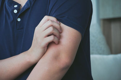 Midsection of woman with hands