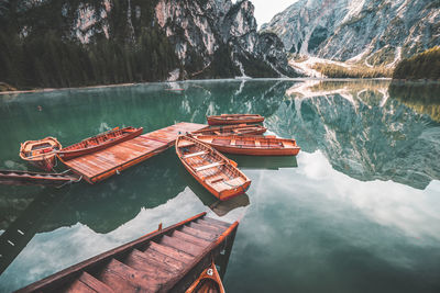 Boat moored on rock by lake