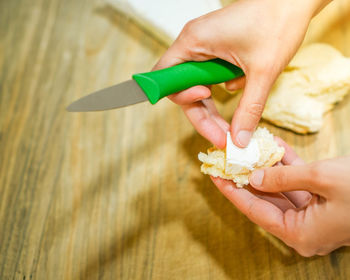 Cropped hand of person holding thermometer