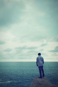 Scenic view of sea against cloudy sky