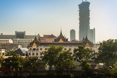 Buildings in city against sky