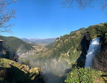 Scenic view of mountains against clear blue sky