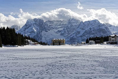 Scenic view of snow covered mountains against sky