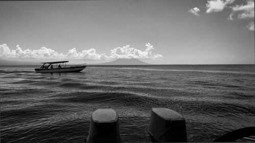 Low section of boat in sea against sky