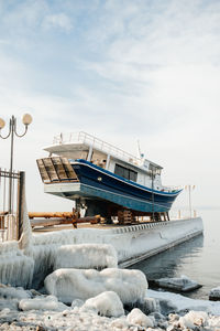 Boats in sea against sky