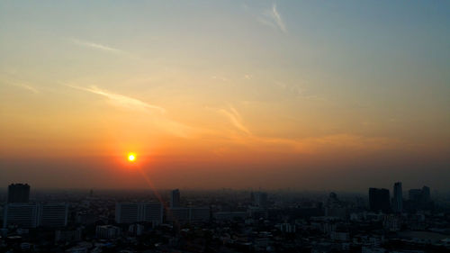 Cityscape against sky during sunset