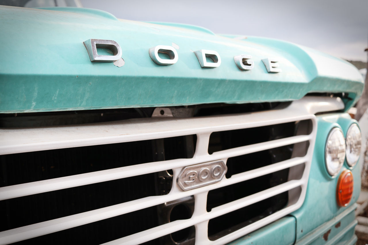 CLOSE-UP OF VINTAGE CAR ON METAL