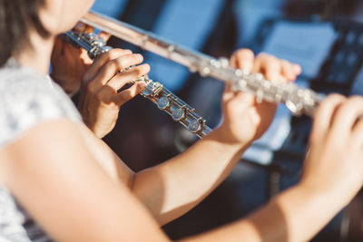 Close-up of man playing guitar