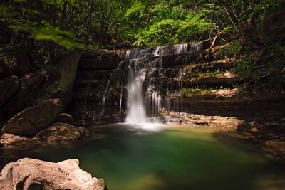 View of waterfall in forest