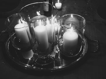 Close-up of illuminated lamp on table