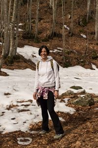 Portrait of young woman in forest