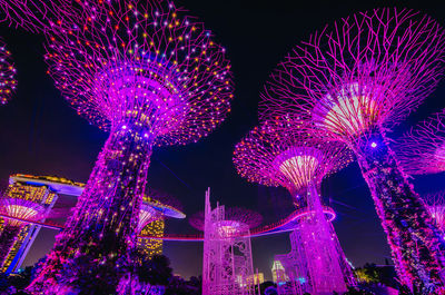 Low angle view of firework display at night