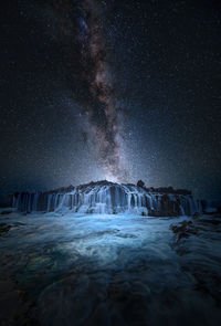 Scenic view of sea against sky at night