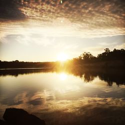 Scenic view of sunset over lake