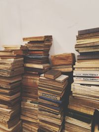 Stack of books against wall