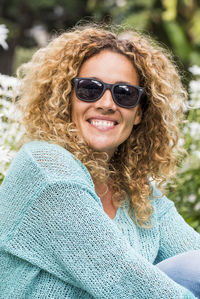 Portrait of young woman wearing sunglasses