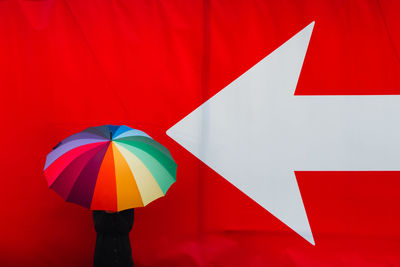 Woman with multi colored umbrella