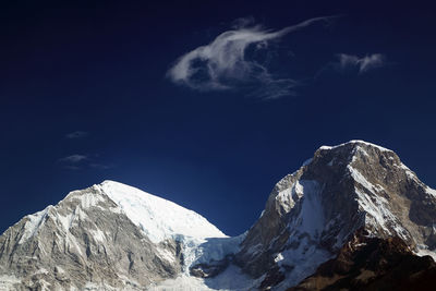 View of snowcapped mountain peaks against sky