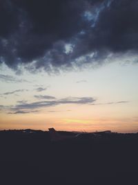 Silhouette landscape against sky during sunset