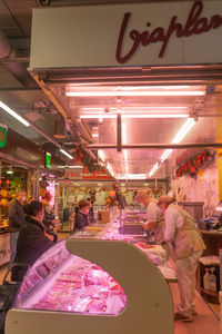 Group of people in restaurant at store