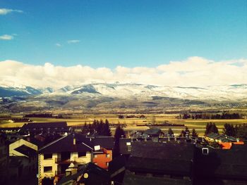 Scenic view of mountains against cloudy sky