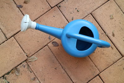 High angle view of telephone booth on tiled floor