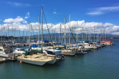 Boats moored at harbor