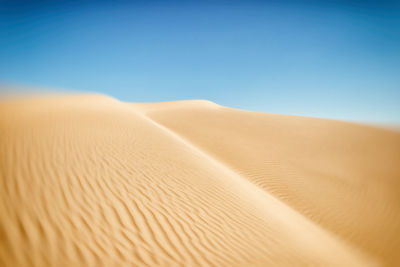 Scenic view of desert against clear sky