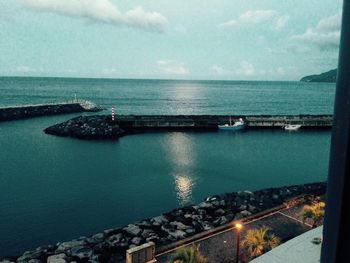 Scenic view of sea against cloudy sky