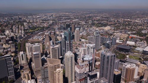 High angle view of modern buildings in city against sky