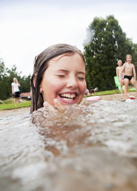 Girl swimming in lake