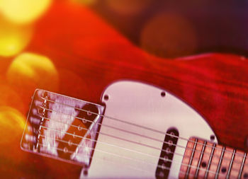 Close up of red guitar